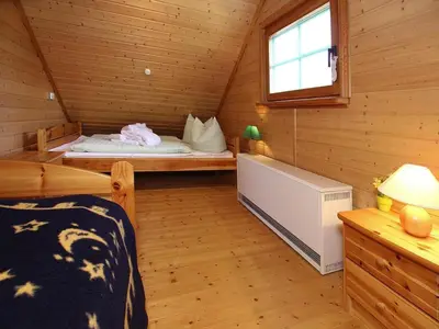Ein Bett oder Betten in einem Zimmer der Unterkunft Ferienhaus , Tanne