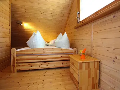 Ein Bett oder Betten in einem Zimmer der Unterkunft Ferienhaus , Tanne