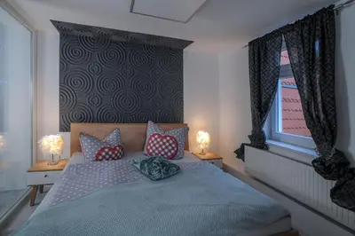Ein Bett oder Betten in einem Zimmer der Unterkunft Designpension Traumschloss Hotel Garni
