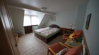 Ein Bett oder Betten in einem Zimmer der Unterkunft Ferienwohnung Zeus