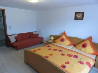 Ein Bett oder Betten in einem Zimmer der Unterkunft Ferienwohnungen mit Wellnessoase in Thale OT Altenbrak