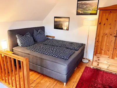 Ein Bett oder Betten in einem Zimmer der Unterkunft Harz im Glück - Fachwerkhaus für zwei in Wernigerode