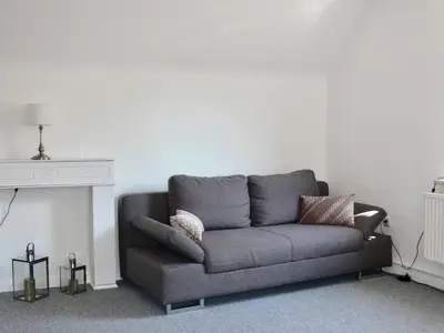 Ein Sitzbereich in der Unterkunft Ferienwohnung Sagenhaft