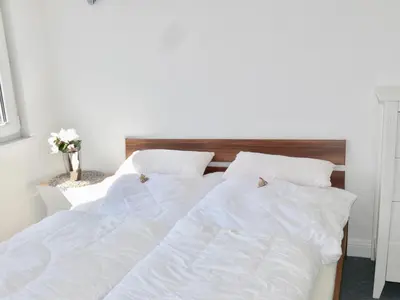 Ein Bett oder Betten in einem Zimmer der Unterkunft Ferienwohnung Sagenhaft