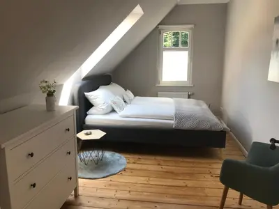 Ein Bett oder Betten in einem Zimmer der Unterkunft Villa Hanne mit Garten