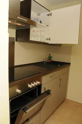 Küche/Küchenzeile in der Unterkunft Apartments am Brunnen