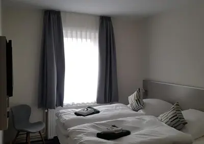 Ein Bett oder Betten in einem Zimmer der Unterkunft Hotel Silbertanne