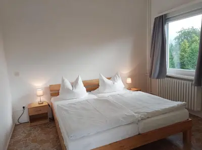 Ein Bett oder Betten in einem Zimmer der Unterkunft Pension Sonnenhof