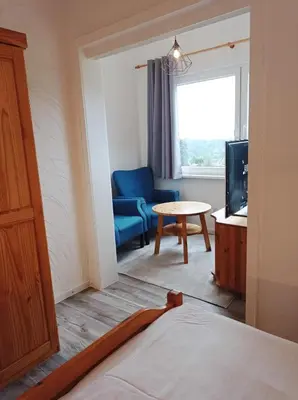Ein Bett oder Betten in einem Zimmer der Unterkunft Pension Sonnenhof
