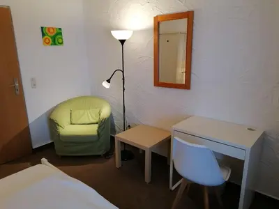 Ein Bett oder Betten in einem Zimmer der Unterkunft Pension Sonnenhof