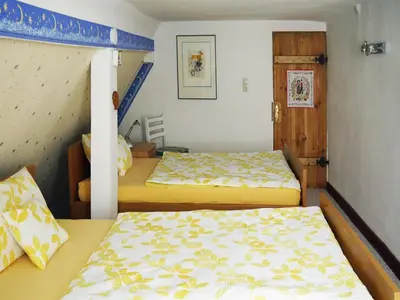 Ein Bett oder Betten in einem Zimmer der Unterkunft Ferienhaus Oliv