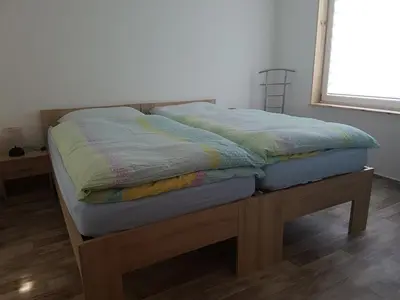 Ein Bett oder Betten in einem Zimmer der Unterkunft Ferienhaus Am Graseberg