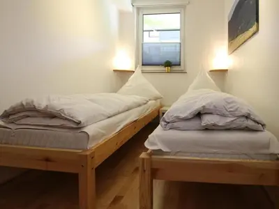 Ein Bett oder Betten in einem Zimmer der Unterkunft Ferienwohnung Zauberhexe in Braunlage