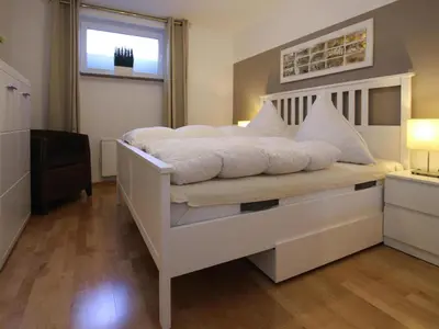 Ein Bett oder Betten in einem Zimmer der Unterkunft Ferienwohnung Zauberhexe in Braunlage