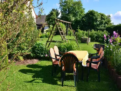 Ein Garten an der Unterkunft Ferienwohnung in den Hüttenroder Bergen