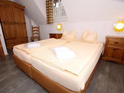Ein Bett oder Betten in einem Zimmer der Unterkunft Ferienhaus in Wernigerode mit Innenpool