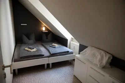 Ein Bett oder Betten in einem Zimmer der Unterkunft Harznester - Ferienhaus am Thie