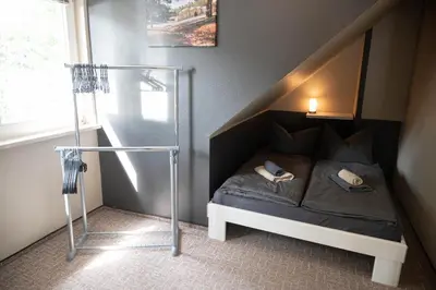Ein Bett oder Betten in einem Zimmer der Unterkunft Harznester - Ferienhaus am Thie