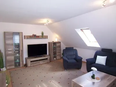 Ein Sitzbereich in der Unterkunft Ferienwohnung Vier Sterne