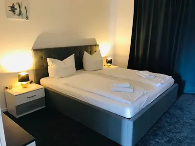 Ein Bett oder Betten in einem Zimmer der Unterkunft Ferienwohnung Harzblick 3