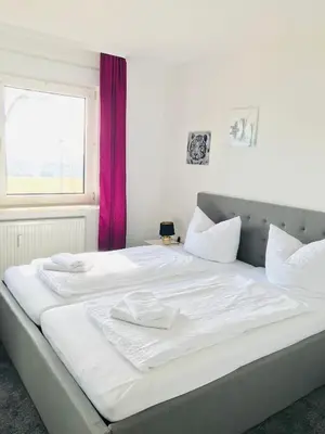 Ein Bett oder Betten in einem Zimmer der Unterkunft Ferienwohnung Harzblick 3