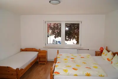 Ein Bett oder Betten in einem Zimmer der Unterkunft Ferienwohnung Nitzschke