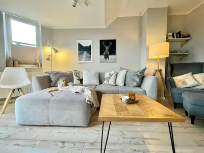 Ein Sitzbereich in der Unterkunft GUGLHUPF Wohlfühl-Maisonette mit Boxspring, NETFLIX, Fahrstuhl