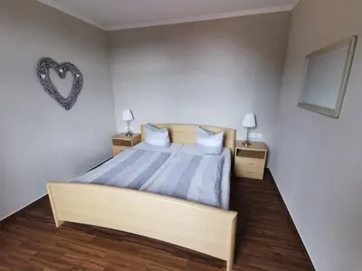 Ein Bett oder Betten in einem Zimmer der Unterkunft Ferienwohnung mit Brockenblick Ginko