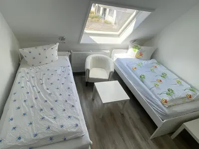 Ein Bett oder Betten in einem Zimmer der Unterkunft Hotel Braunlage