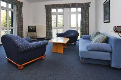 Ein Sitzbereich in der Unterkunft Apartment in fir with a balcony or a terrace