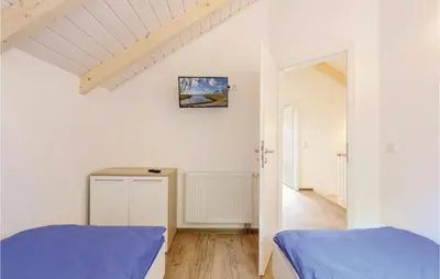 Ein Bett oder Betten in einem Zimmer der Unterkunft Ferienhausdorf Thale