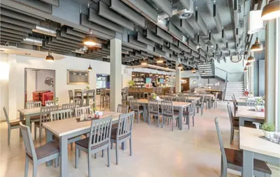 Ein Restaurant oder anderes Speiselokal in der Unterkunft Ferienhausdorf Thale