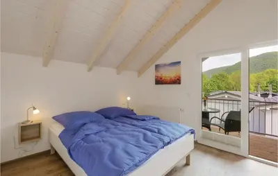 Ein Bett oder Betten in einem Zimmer der Unterkunft Ferienhausdorf Thale