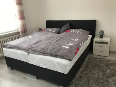 Ein Bett oder Betten in einem Zimmer der Unterkunft FeWo Altstadt - Mitten im Herz Goslar