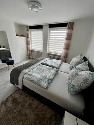Ein Bett oder Betten in einem Zimmer der Unterkunft FeWo Altstadt - Mitten im Herz Goslar