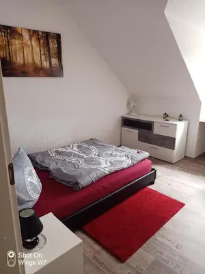 Ein Bett oder Betten in einem Zimmer der Unterkunft Ferienhaus Mina im Harz