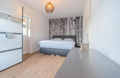 Ein Bett oder Betten in einem Zimmer der Unterkunft Zur Quelle