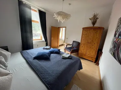 Ein Bett oder Betten in einem Zimmer der Unterkunft Art Apartment - Harz