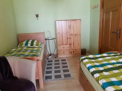 Ein Bett oder Betten in einem Zimmer der Unterkunft Ferienwohnungen Vier Jahreszeiten