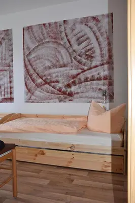 Ein Bett oder Betten in einem Zimmer der Unterkunft Gästewohnung Neustädter Straße 35