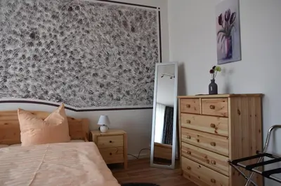 Ein Bett oder Betten in einem Zimmer der Unterkunft Gästewohnung Neustädter Straße 35