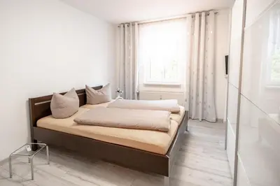 Ein Bett oder Betten in einem Zimmer der Unterkunft Ferienwohnungen am 