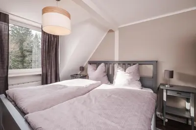 Ein Bett oder Betten in einem Zimmer der Unterkunft Schierke Ferienwohnung Hirschrudel