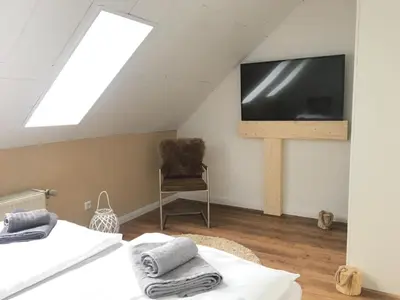 Ein Bett oder Betten in einem Zimmer der Unterkunft Luxuriöse 3-Zi. Ferienwohnung Jagdromantik 200 m bis zur Wurmbergsseilbahn