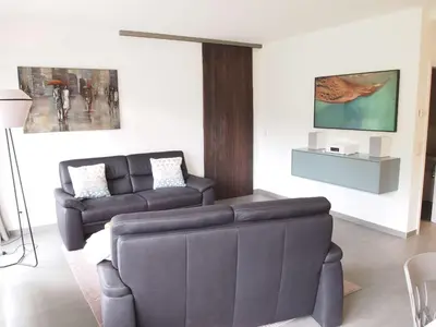 Ein Sitzbereich in der Unterkunft Ferienwohnung GrünWald