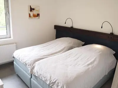 Ein Bett oder Betten in einem Zimmer der Unterkunft Ferienwohnung GrünWald