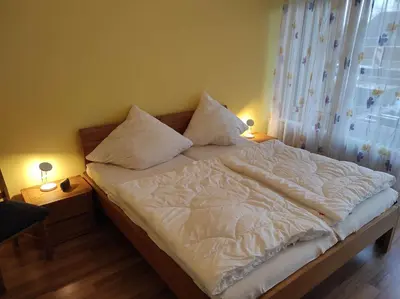 Ein Bett oder Betten in einem Zimmer der Unterkunft Ferienwohnung Waldkauz