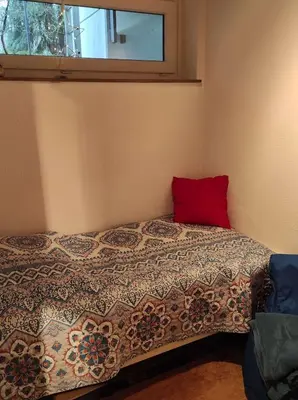 Ein Bett oder Betten in einem Zimmer der Unterkunft Ferienwohnung Waldkauz