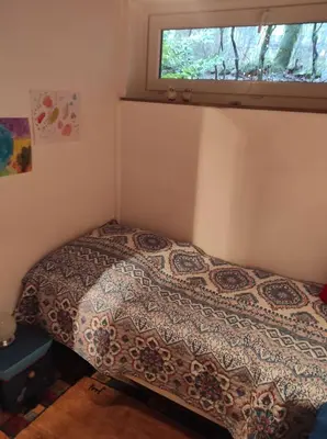 Ein Bett oder Betten in einem Zimmer der Unterkunft Ferienwohnung Waldkauz