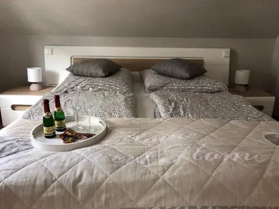 Ein Bett oder Betten in einem Zimmer der Unterkunft Fewo-Am-Hahnenberg